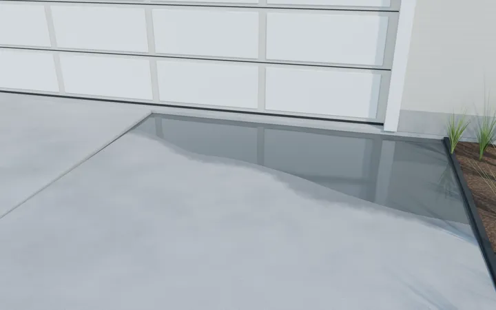 3D render of a driveway slab sunk at the garage door with water against the door